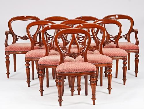 A set of ten Victorian style mahogany balloon back dining chairs, on baluster reeded supports, to include a pair of carvers, (10).