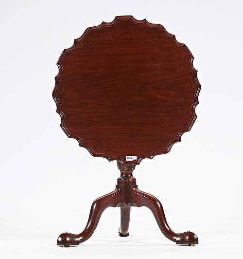 An 18th century mahogany occasional table, the snap pie-crust top on spiral column and tripod base, 70cm wide x 68cm high.