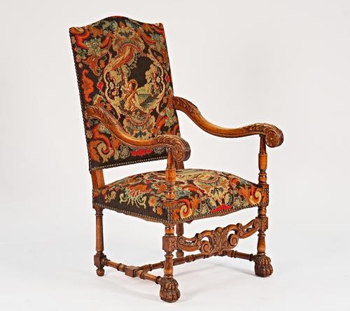 A Louis XIV style beech framed high back open armchair