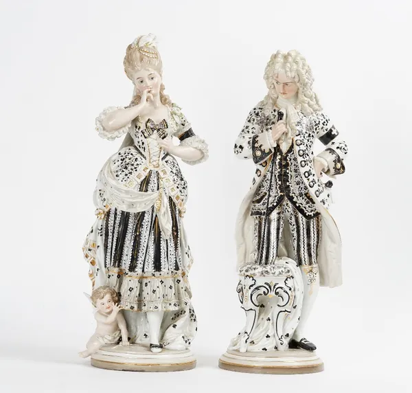 A large pair of Scheibe Alsbach porcelain figures of a gallant and companion, late 19th/early 20th century, coloured mostly in black and gilt, he...