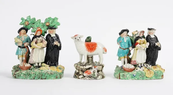 Two Staffordshire pearlware tithe pig groups, circa 1820, of traditional form, each with the three characters standing before a tree on a grassy...