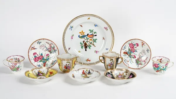 Two Dresden quatrelobed cups and saucers, late 19th century, painted with panels of courting couples and flowers against a yellow or black ground,...