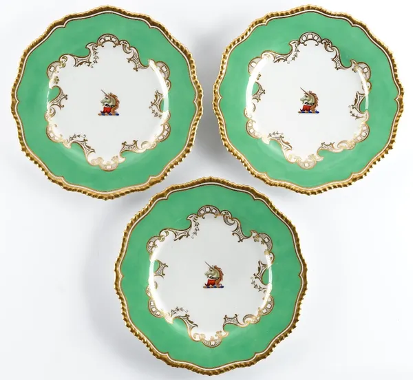 Three Flight, Barr & Barr, Worcester crested plates, circa 1825, each painted with the head of a unicorn against a green ground and gilt gadroon...