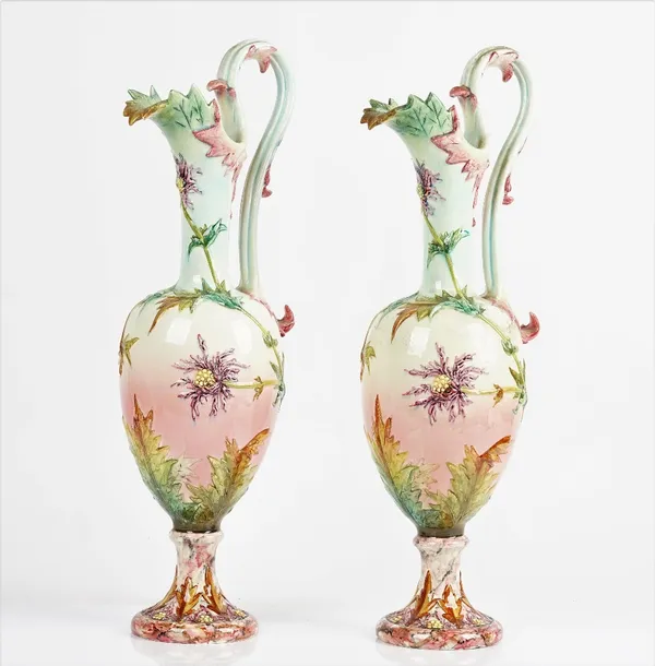 Delphin Massier ( 1836- 1907) a pair of tall Vallauris majolica ewers (2)