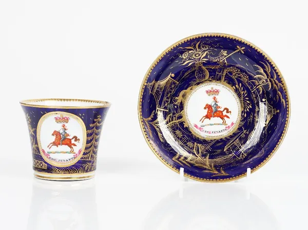 A Chamberlain Worcester armorial blue-ground cup and saucer, circa 1815, each painted with a knight on horseback beneath a coronet and above the...