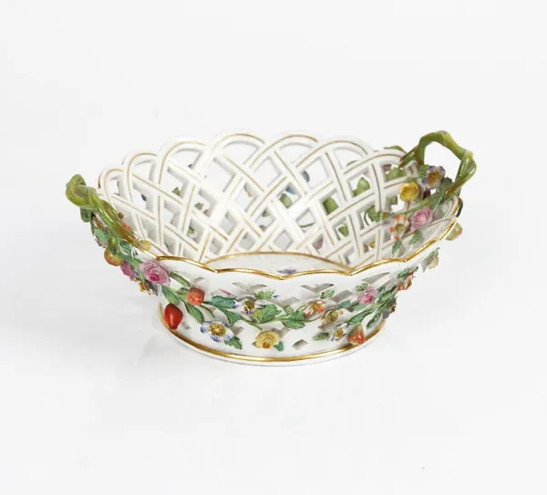 A Meissen outside- decorated  two-handled circular pierced basket, late 19th century, applied with fruit and flowers and painted to the interior with...
