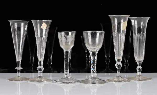 A group of six drinking glasses, 18th and 19th century, comprising; a plain stemmed wine glass, mid 18th century, engraved with a bird and fruiting...