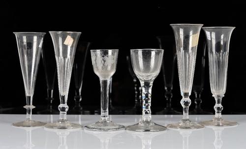 A group of six drinking glasses, 18th and 19th century, comprising; a plain stemmed wine glass, mid 18th century, engraved with a bird and fruiting...