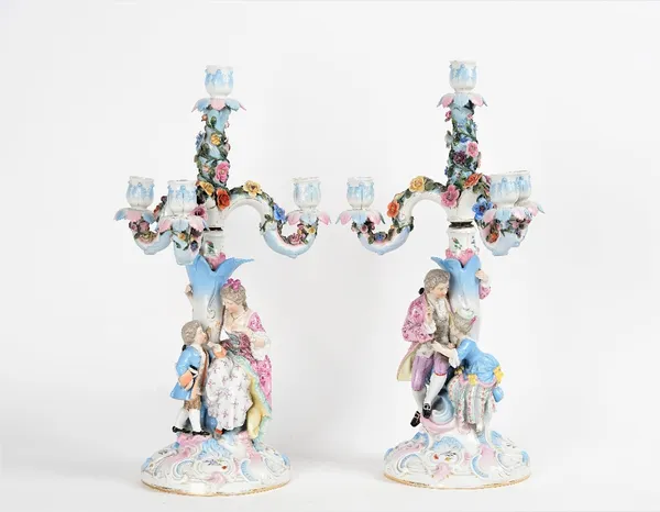 A pair of German porcelain four-light candelabra