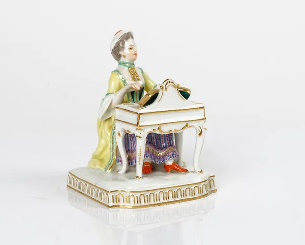 A Meissen figure of Hearing from a set of the Senses, 20th century, modelled as a young woman seated at a spinet, blue crossed swords mark, incised...