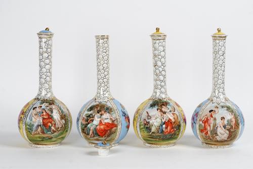 A pair of Victoria China yellow-ground bottle vases, early 20th century, each printed with classical figurative panels alternating with flowers...