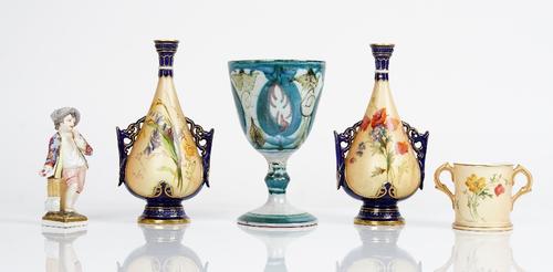 A group of English and Continental ceramics, late 19th and 20th century, comprising; a pair of Royal Worcester slender two-handled vases, circa 1898,...