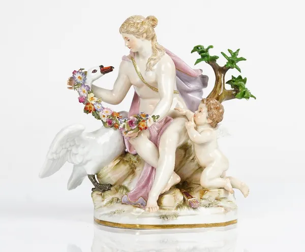 A Meissen outside decorated group of Leda and the Swan, late 19th century, the maiden seated on a tree stump with cupid at her side, draping a floral...