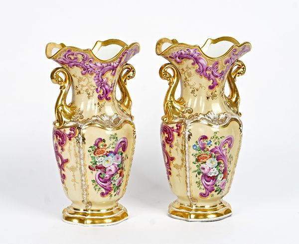 A pair of French porcelain two-handled baluster vases, mid 19th century, the lobed body painted with panels of flowers inside gilt frames against a...