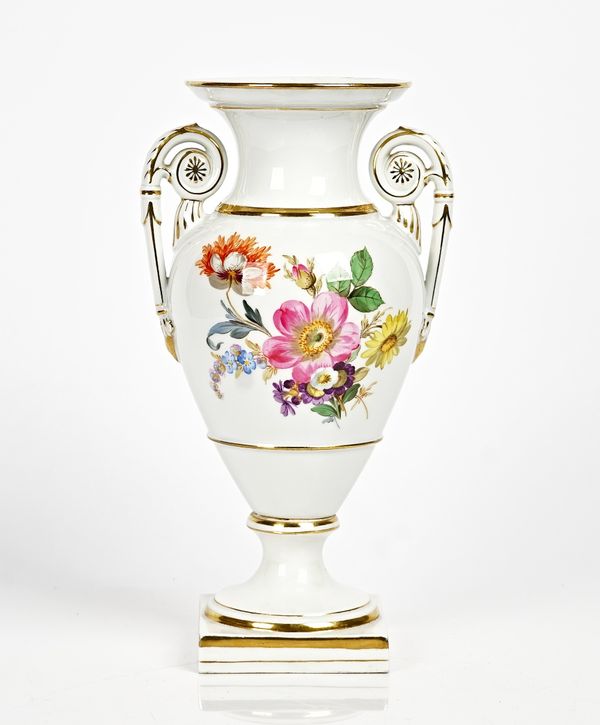 A Meissen two-handled ovoid vase, early 20th century, each side painted with a group of flowers, raised on a socle foot and square base, blue crossed...