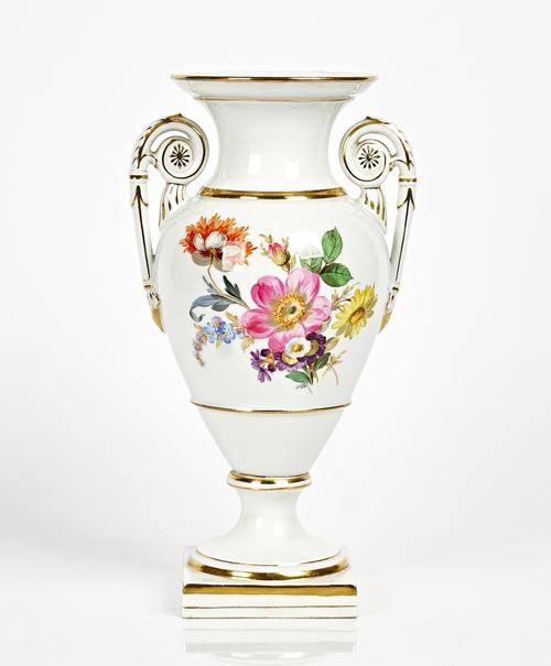 A Meissen two-handled ovoid vase, early 20th century, each side painted with a group of flowers, raised on a socle foot and square base, blue crossed...