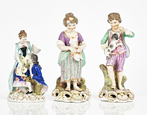 A pair of Stevenson & Hancock, Derby, figures of a shepherd and shepherdess, late 19th/early 20th century, modelled as a boy and girl standing with a...
