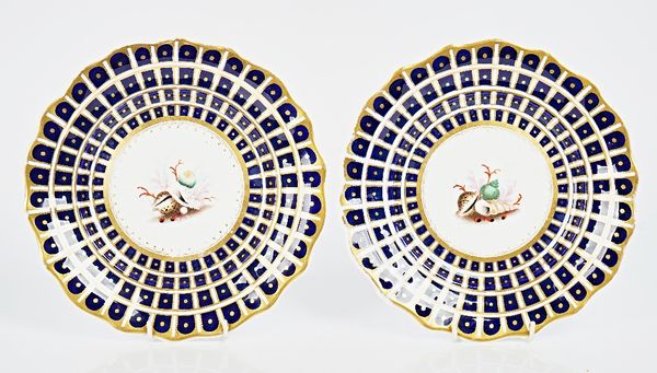 A pair of English porcelain plates or stands, possibly Samuel Alcock, circa