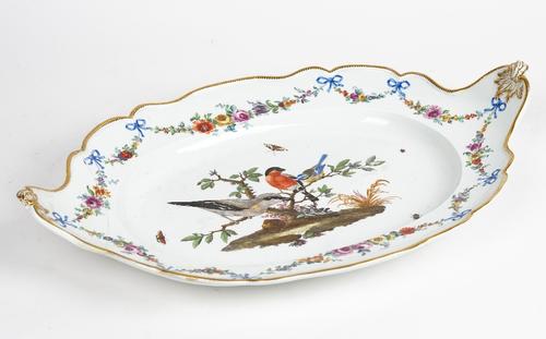 A large Meissen Marcolini period shaped oval stand, late 18th/early 19th century, painted in the centre with three birds perched in branches, beneath...