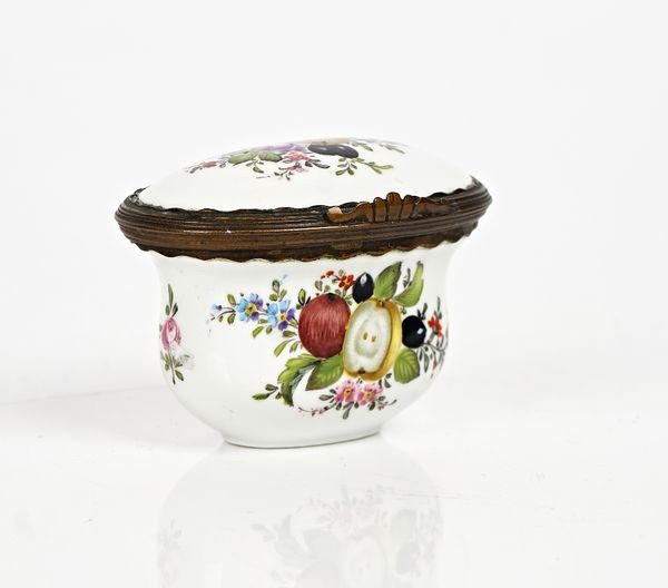 A German porcelain snuff box, 19th century, oval form with waisted sides, painted with fruit, flowers and nuts, the inside of the cover painted with...