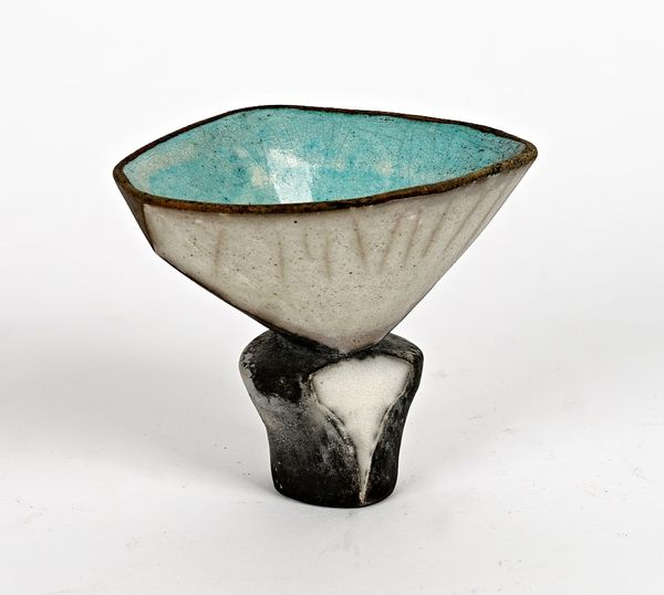 Elizabeth Raeburn ( born 1943), a raku glazed footed vessel