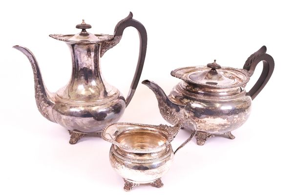 A silver three piece part tea and coffee set, comprising; a teapot with black fittings, a coffee pot with black fittings and a milk jug, each piece...