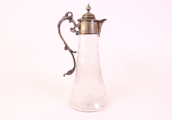 A Victorian silver plated metal mounted glass claret jug and a bottle coaster (2)
