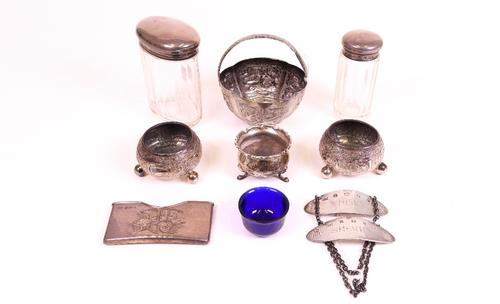 Silver and silver mounted wares, comprising; a pair of Victorian circular salts, decorated in the Indian taste, each raised on three spherical feet,...