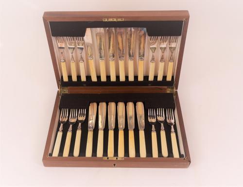 Plated wares, comprising; two oval serving dishes, a set of twelve pairs of fish knives and forks, cased, a three piece tea set, comprising; a...