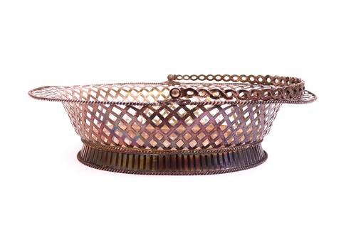 A late George II silver cake basket of oval form.