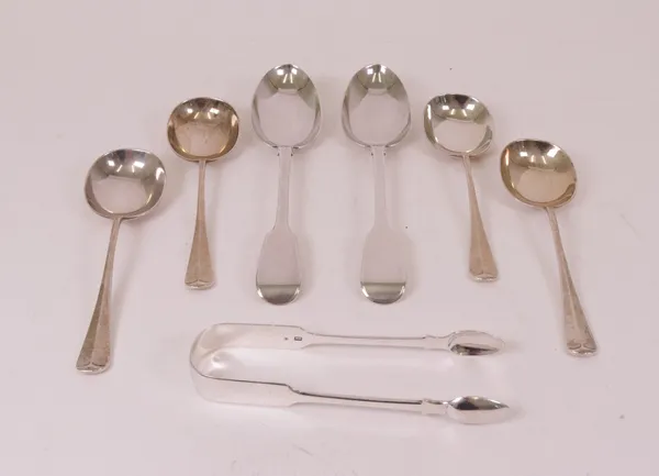 A group of silver table flatware, comprising; four rat tail pattern soup spoons, Sheffield 1928, a pair of fiddle pattern table spoons, Exeter 1855...
