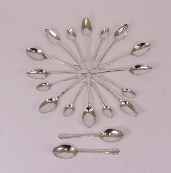 A group of silver table flatware, comprising; a set of six grapefruit spoons, Sheffield 1970, a set of six teaspoons, Sheffield 1973 and a set of six...