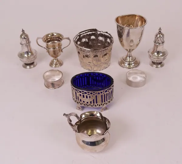 Silver, comprising; a cream jug, two trophy cups, napkin ring and two pepperettes, combined weight 220 gms and foreign wares, comprising; a cream...