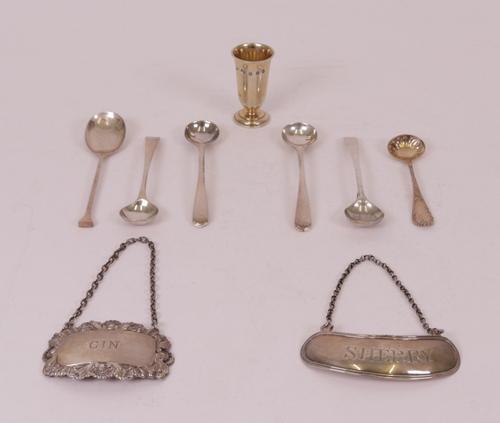Silver, comprising; four salt spoons, a teaspoon, a Sterling salt spoon, an Irish decanter label detailed Sherry, Dublin 1811,