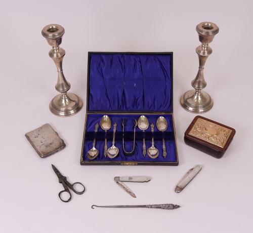 Silver and silver mounted wares, comprising; a pair of table candlesticks, Birmingham 1978, height 20.5cm (loaded), a set of six figure terminal...