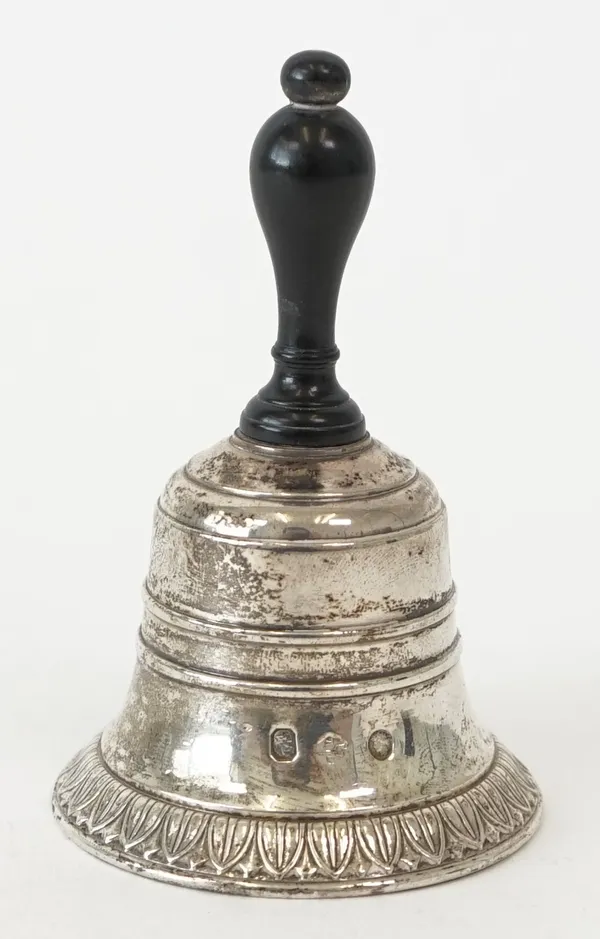 A French table bell. decorated with a palmette band, fitted with an ebonised handle, height 8.5cm, mid-19th century, gross weight 103 gms.  7086