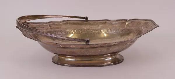 A George III silver cake or bread basket, of shaped oval form, decorated with fruit and foliate scrolls to the band
