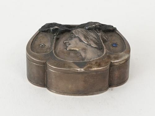 A diamond and cabochon sapphire set hinge lidded box, the cover decorated with the portrait of a lady