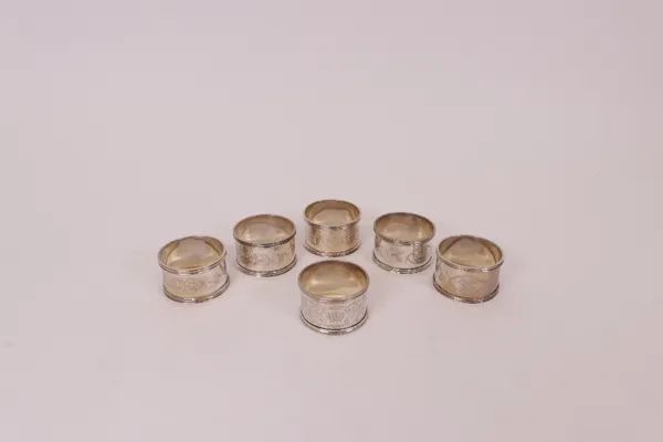 A group of silver napkin rings. (6)