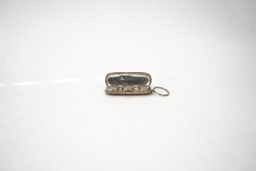 A silver triple compartment  sovereign case.