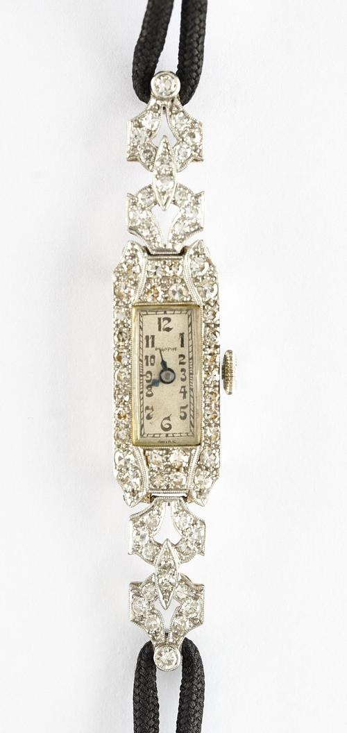 A Mappin platinum and diamond set lady's dress wristwatch, with a jewelled lever movement, the signed silvered dial with black Arabic numerals, the...
