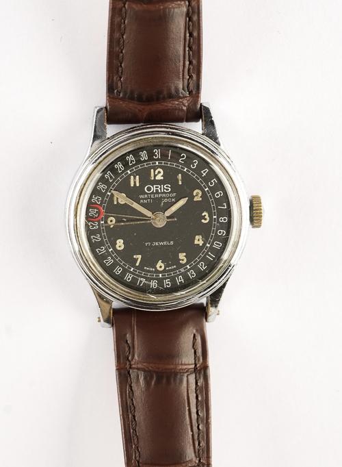 An Oris Calendar wristwatch.