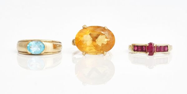 Three gold and gem set rings, (3).