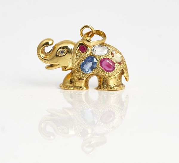 A gold and gemstone set elephant pendant.