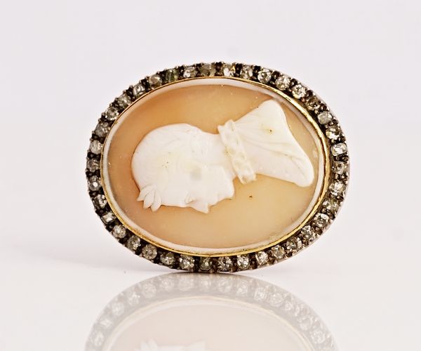 A shell cameo and diamond brooch.