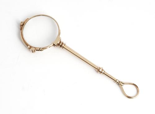 A pair of gold framed lorgnettes.