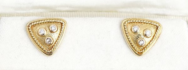 A pair of gold and diamond earstuds, each of triangular form, mounted with two circular cut diamonds and with one rose cut diamond, within ropetwist...