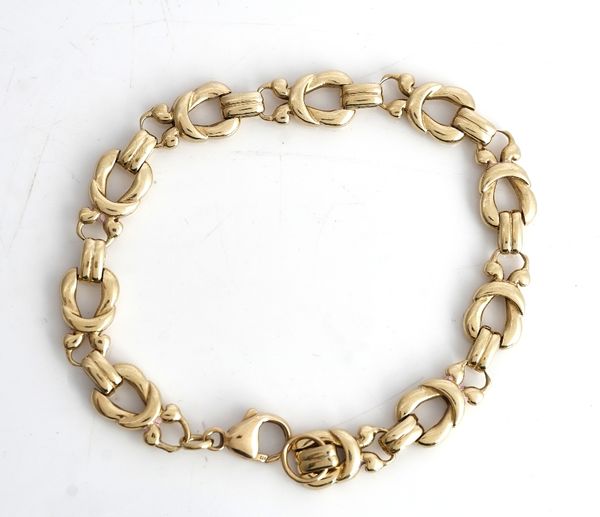A 9ct gold bracelet, in a multiple link design, on a sprung hook shaped clasp, length of bracelet 19cm, with a spare link, combined weight 20.5 gms.