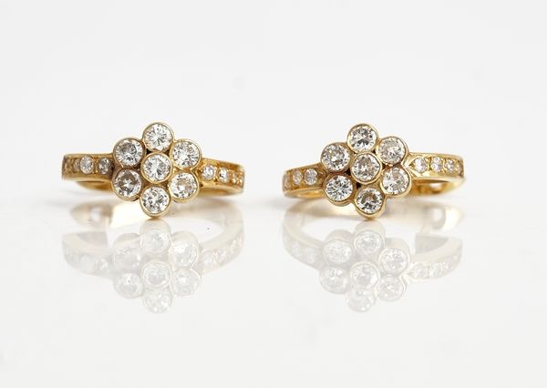 A pair of gold and diamond earrings