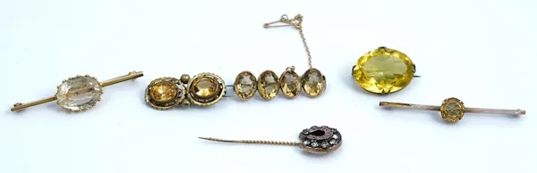A gold brooch, collet set with a row of four oval cut citrines and five other brooches (6)